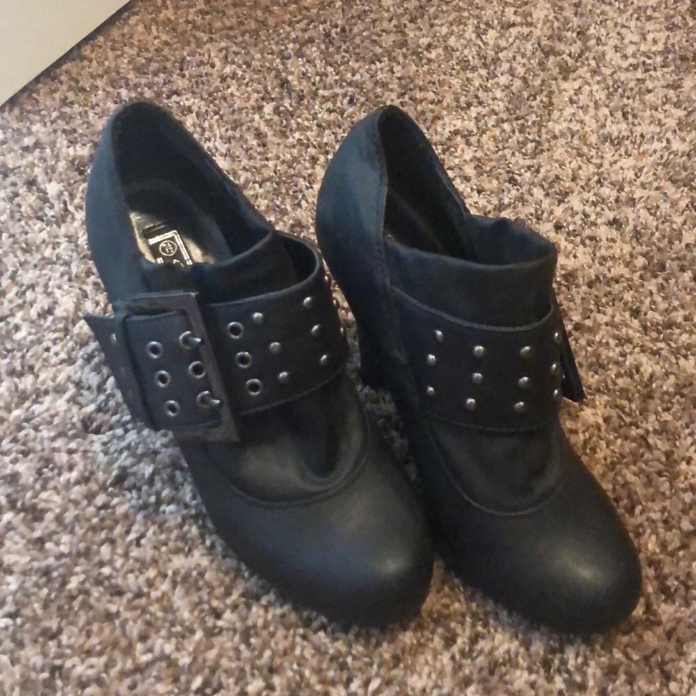 Leather booties, one black one grey